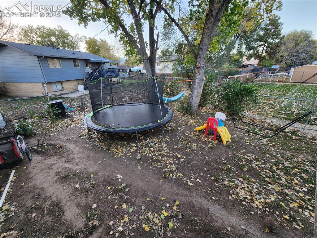 Image 33 of 33: Fenced backyard