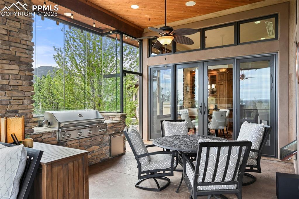 Image 15 of 50: Outdoor kitchen and dining area