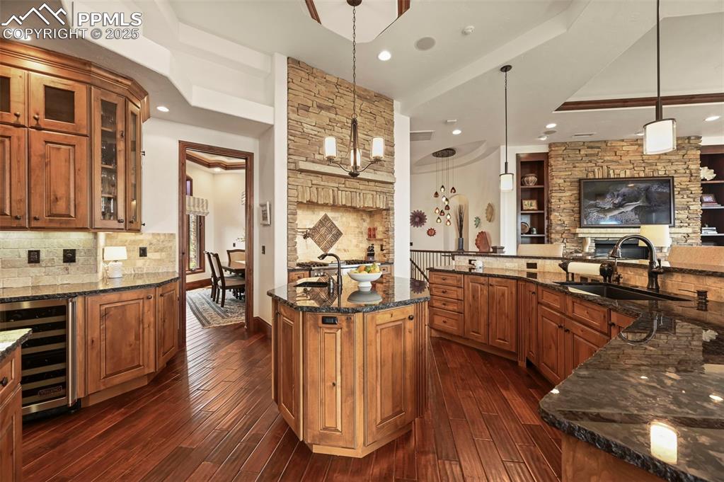 Image 9 of 50: Tons of cabinetry and a built-in wine fridge