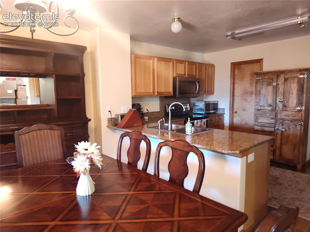 Image 10 of 49: Kithen off the Dining room