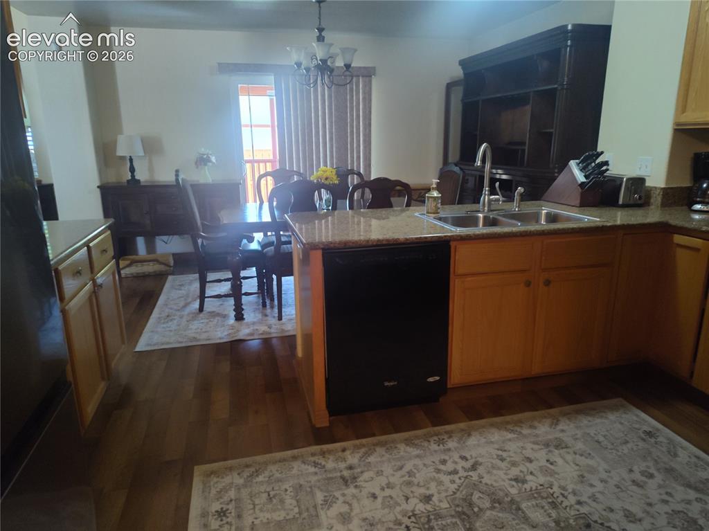 Image 15 of 49: Kitchen going into the dining room