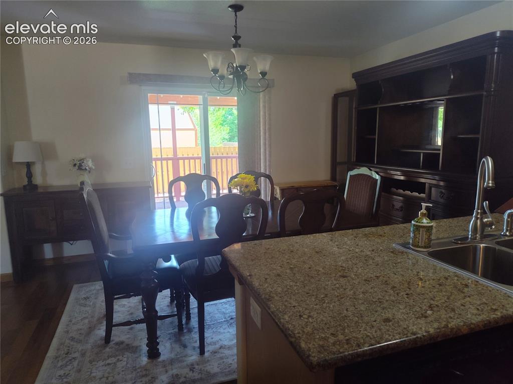 Image 16 of 49: Dining Room leading to walk-out deck