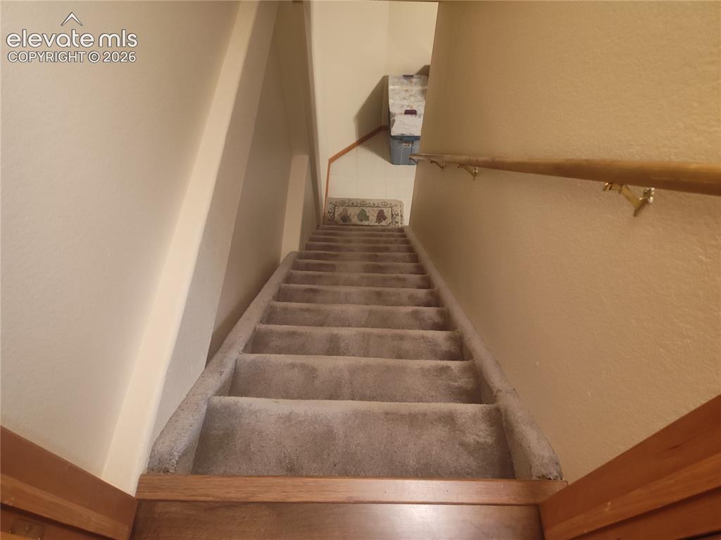 Image 36 of 49: Stairs leading to the basement