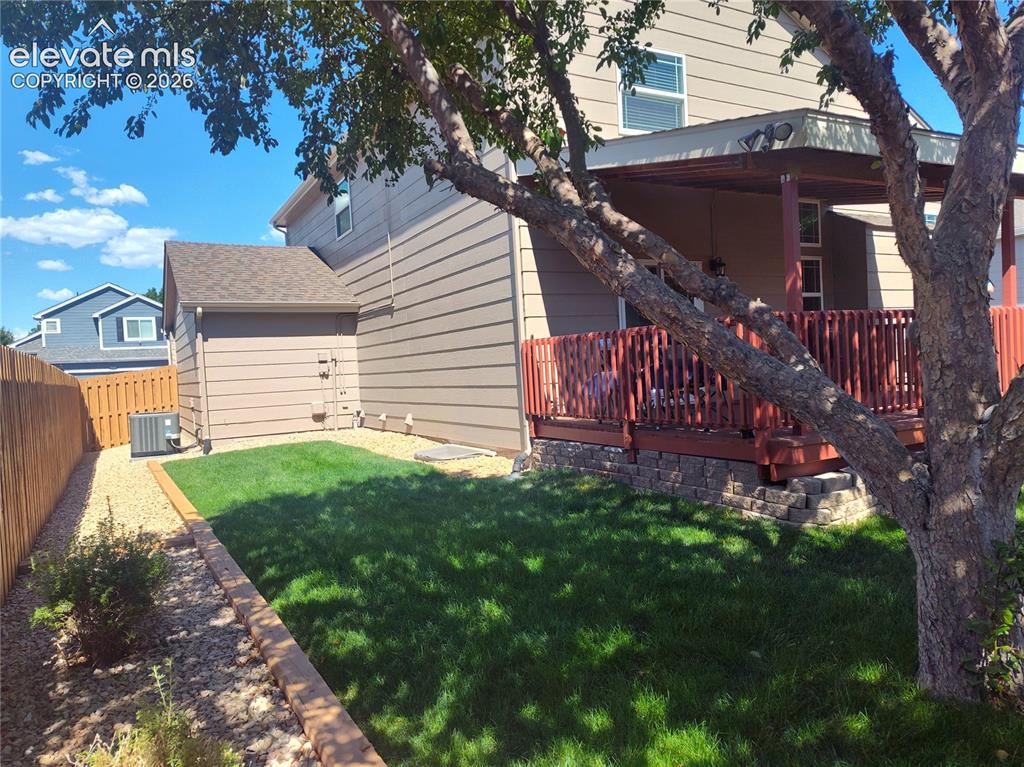 Image 47 of 49: Left side of home frombackyard