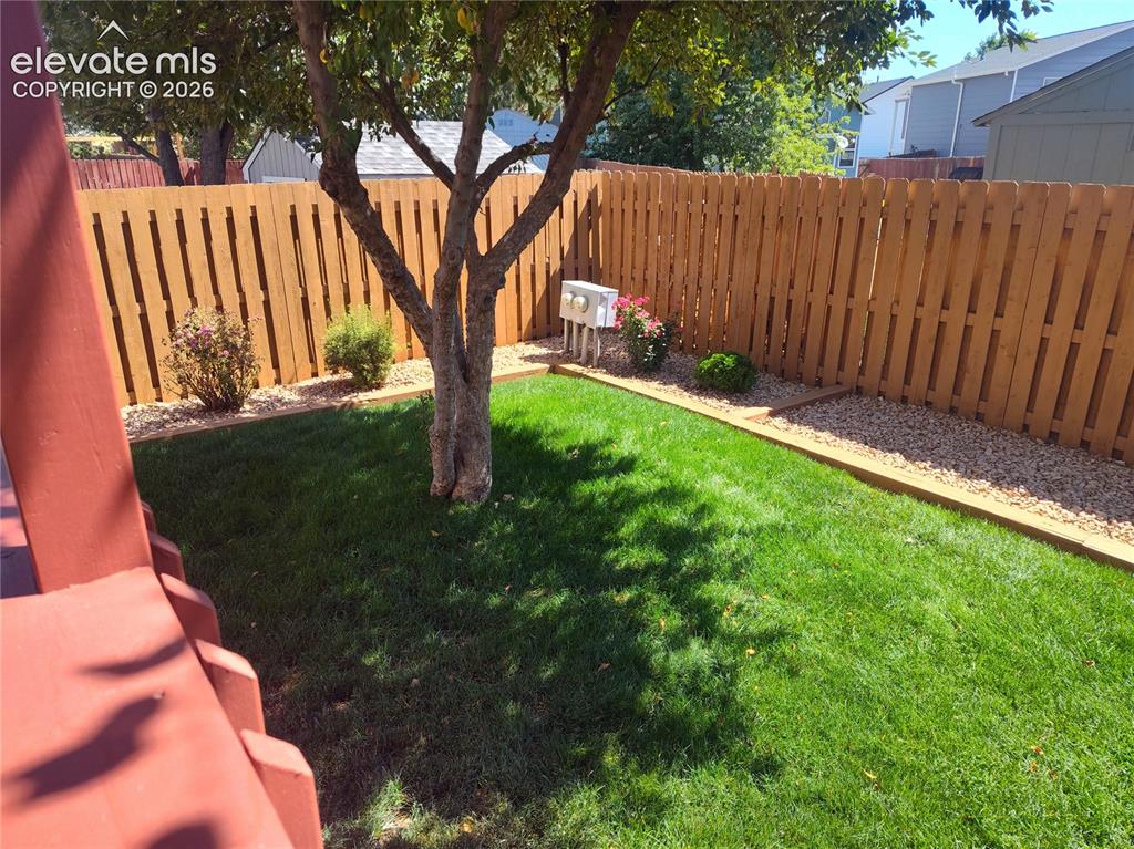 Image 49 of 49: Beautifully manicured backyard