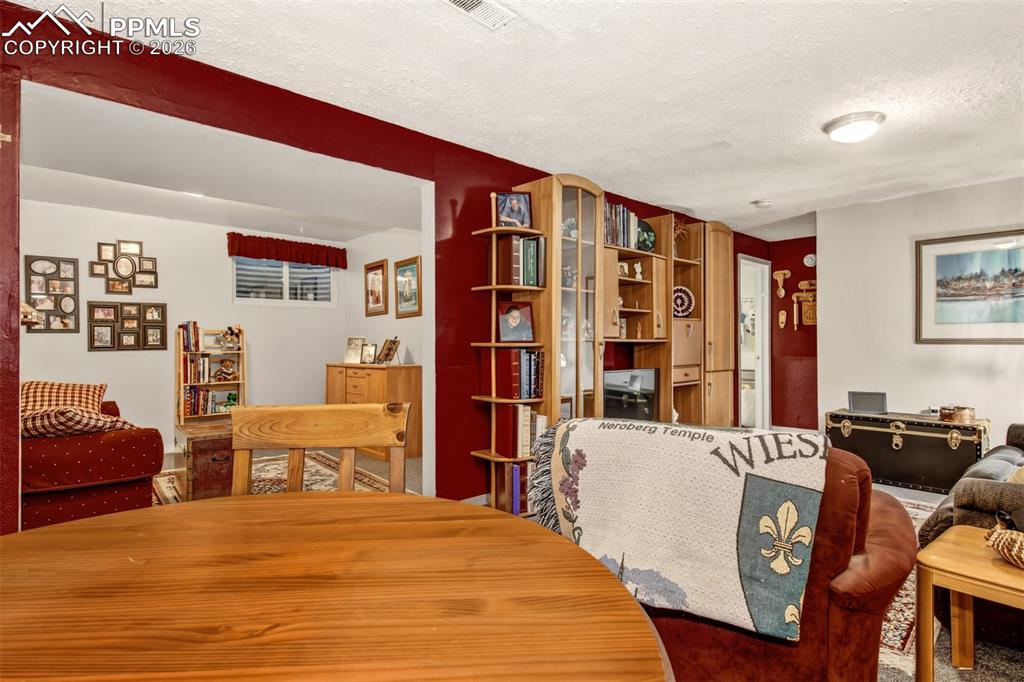 Image 17 of 50: Basement Office open to Family Room