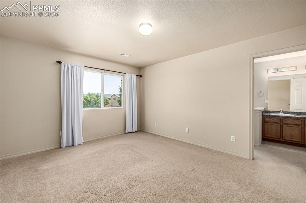 Image 12 of 30: With a 5 piece en suite bathroom and natural lighting overlooking the commu