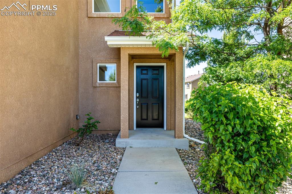 Image 2 of 30: Private entry way with mature trees