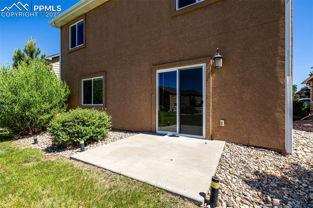 Image 22 of 30: Back patio ideal for grilling and entertaining