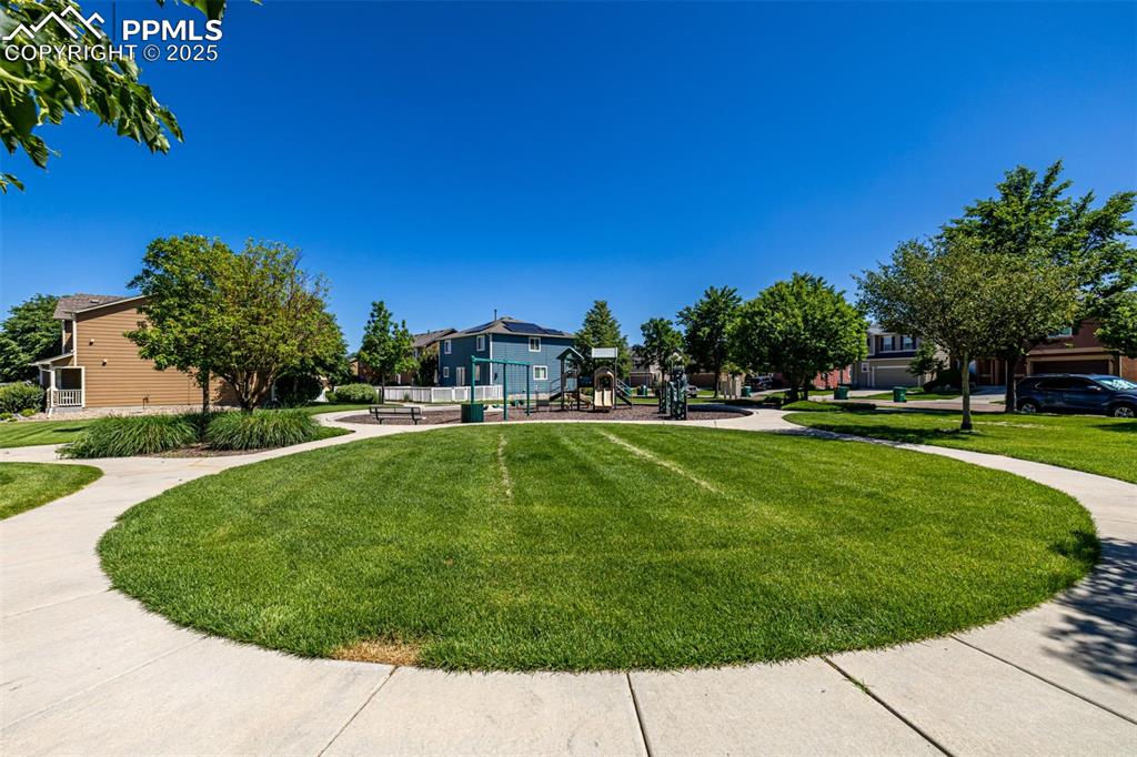 Image 25 of 30: Community green space and park across the street