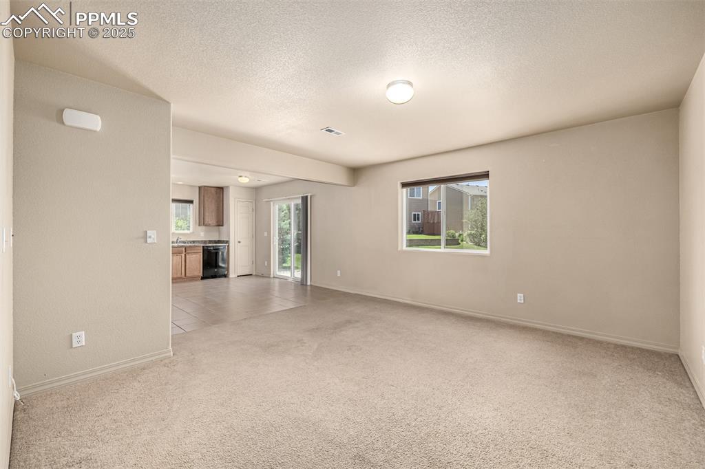 Image 5 of 30: The bright and open living room offers ample space and an open floor plan