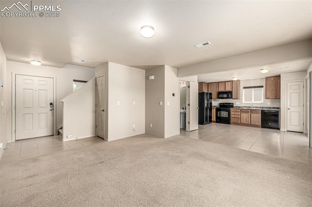 Image 6 of 30: Easy to entertain, the main level living spaces seamlessly flow 