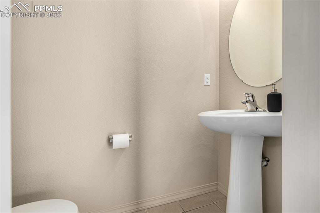 Image 9 of 30: Main level half bathroom