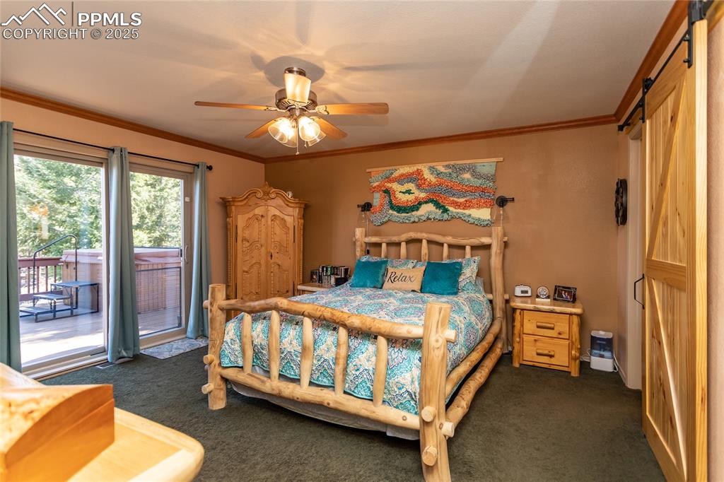 Image 16 of 44: Bedroom featuring sliding glass door with access to outside deck