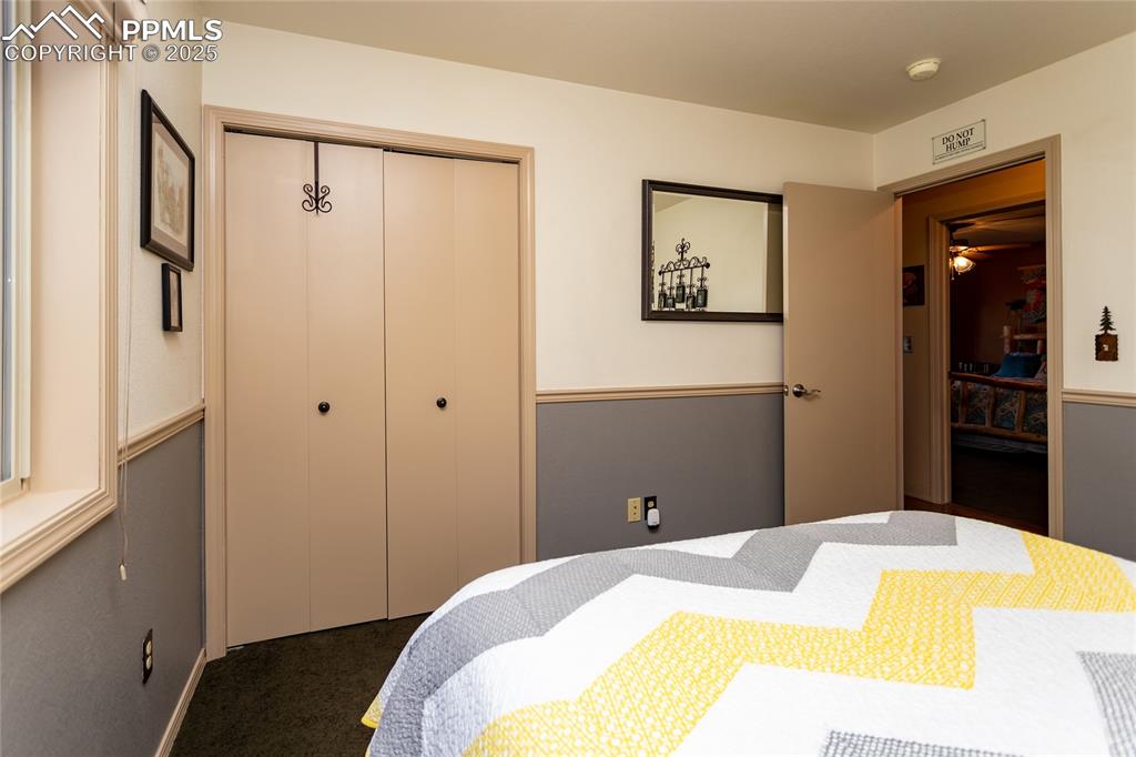 Image 23 of 44: Upper level Bedroom with closet