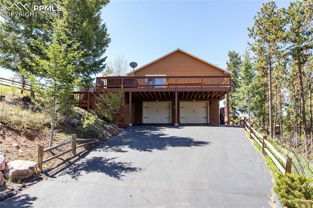 Image 3 of 44: Driveway - Oversized 2 car garage and 2-car carport