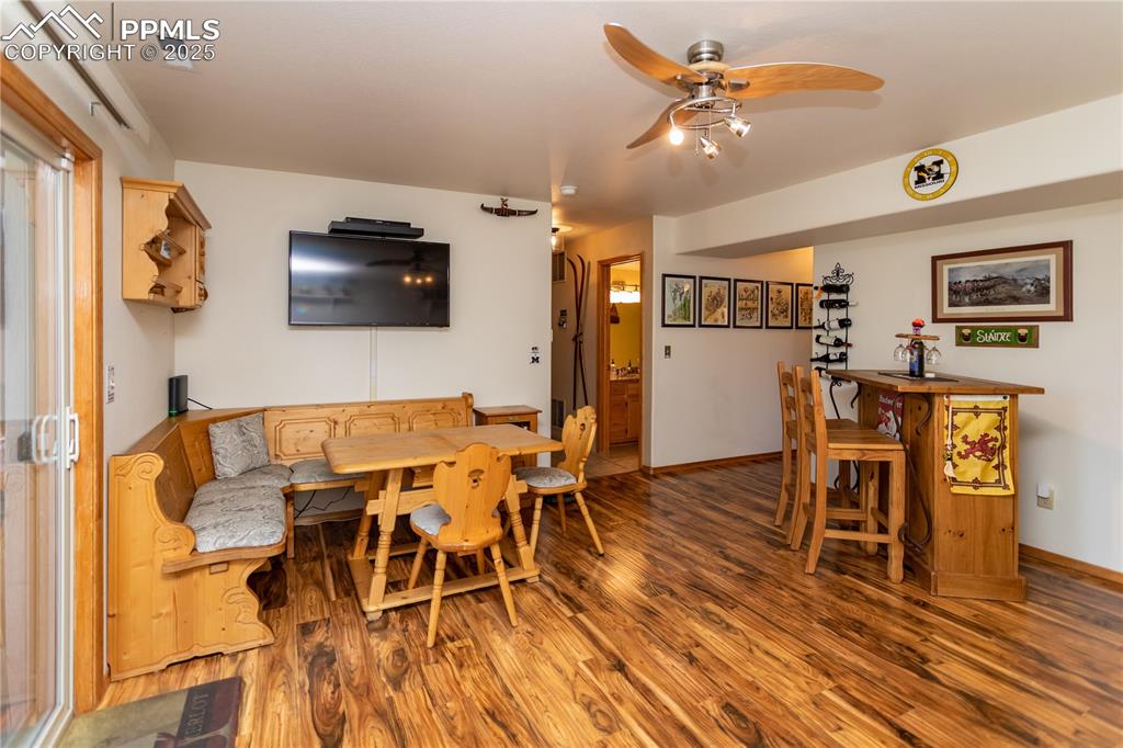 Image 34 of 44: Lower level Family room with wood finished floors, a ceiling fan and walk-o
