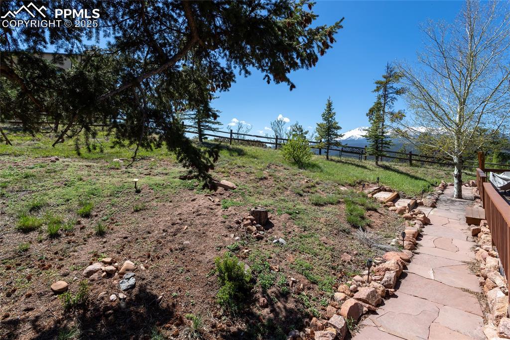 Image 43 of 44: View of yard from Flagstone walkway