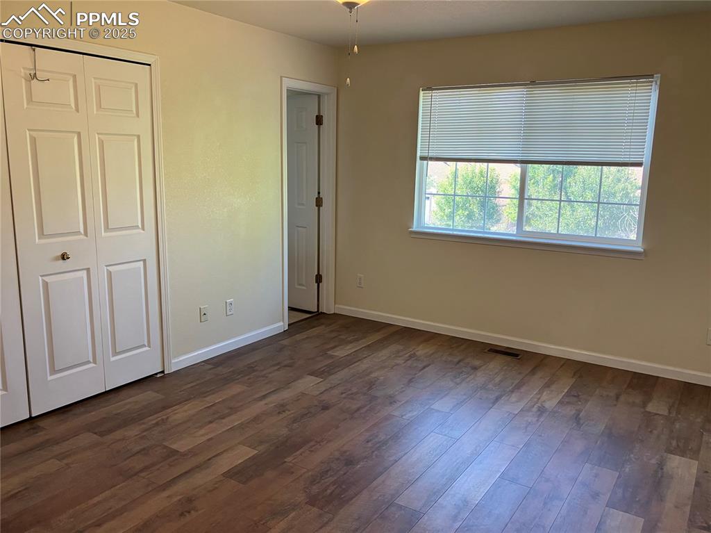 Image 15 of 28: Master bedroom w attached bathroom