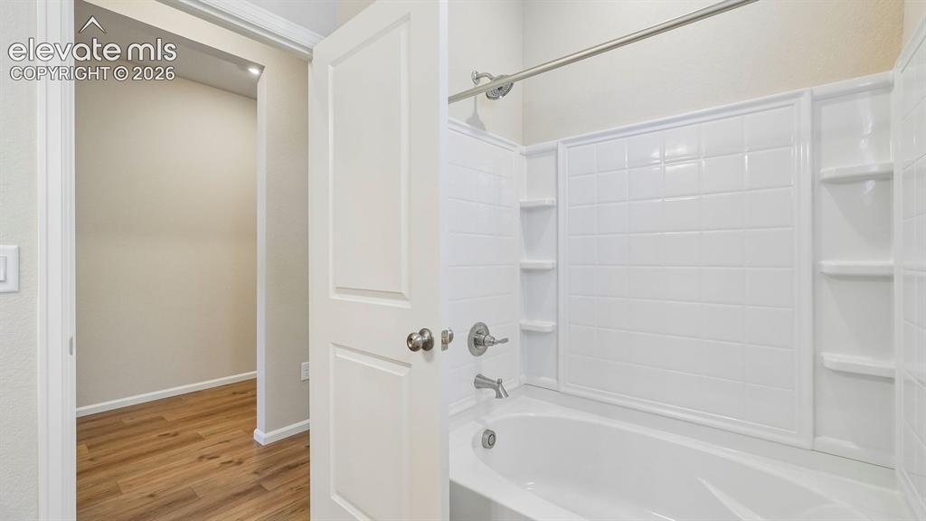 Image 17 of 47: White panel door with satin nickel hardware