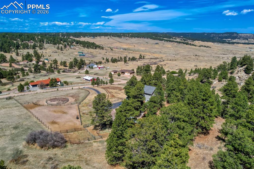 Image 40 of 41: Just wow! Overlooking trees and Bijou Springs Ranch