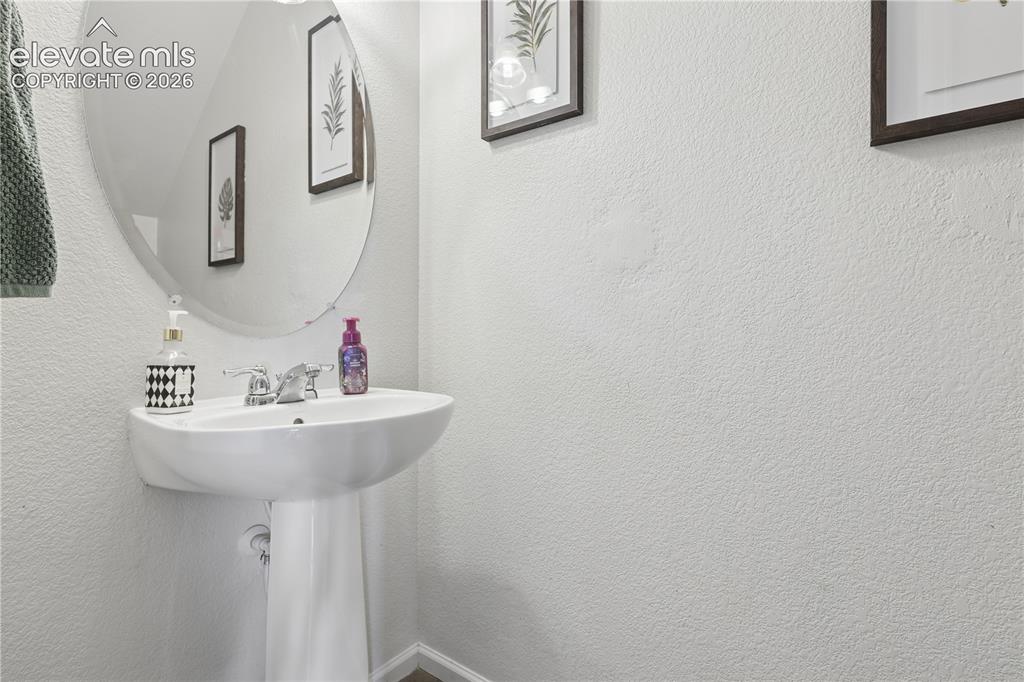 Image 12 of 26: 1/2 Bath located off of the main living area