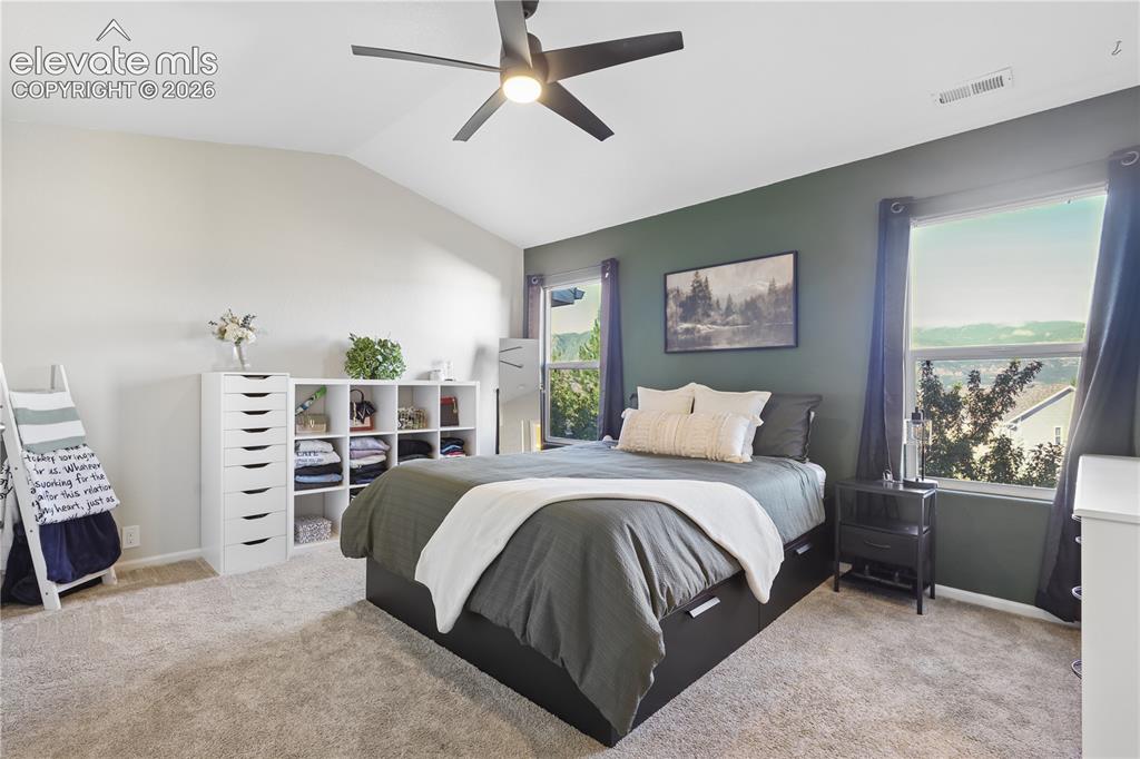 Image 6 of 26: Large master bedroom with two closets and mountain views