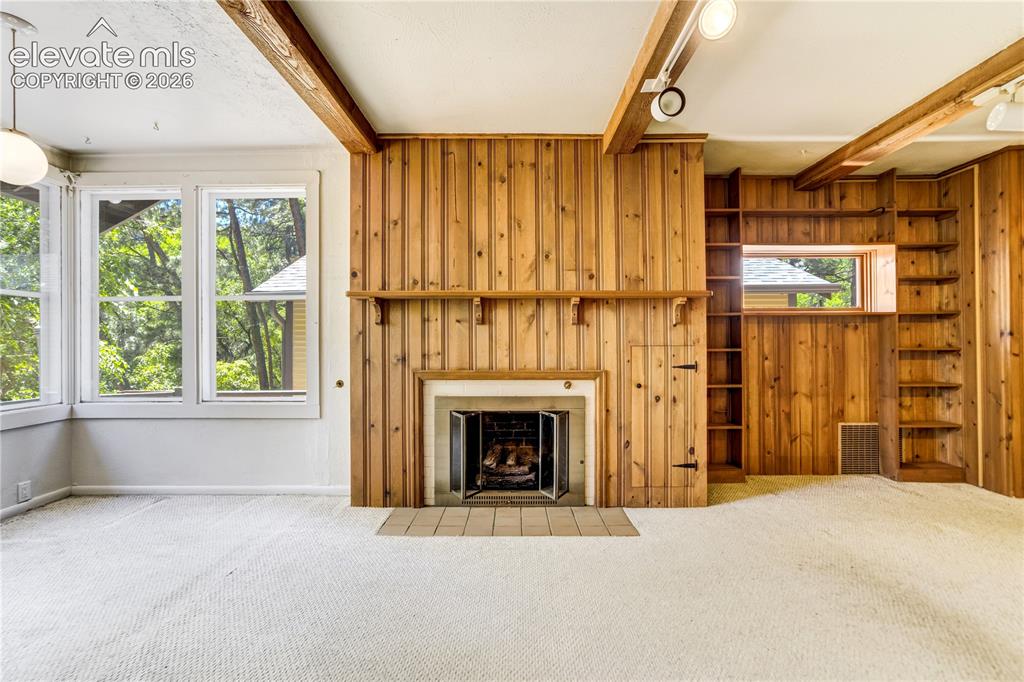 Image 2 of 20: Main level fireplace