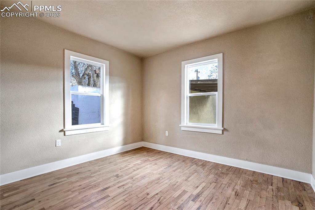 Image 15 of 28: Bedroom with an abundance of natural light