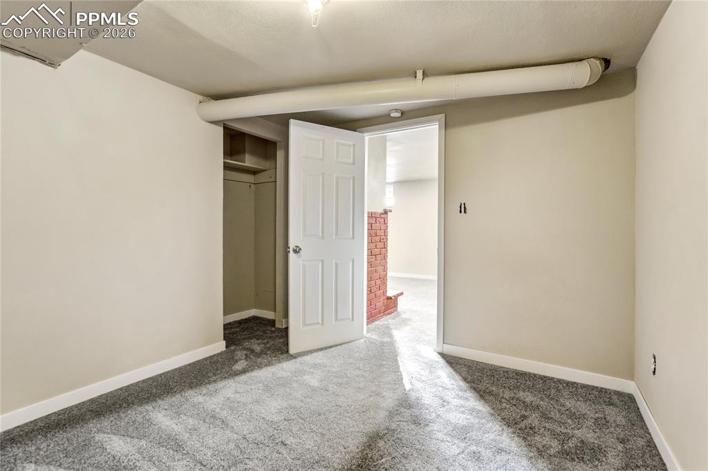 Image 23 of 28: Flex space perfect for an office, gym, playroom or extra living space