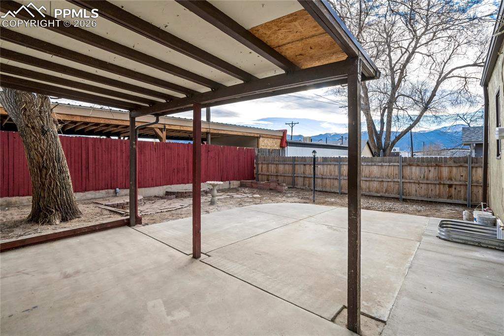 Image 27 of 28: Fenced backyard with mountain views for those Colorado sunsets.