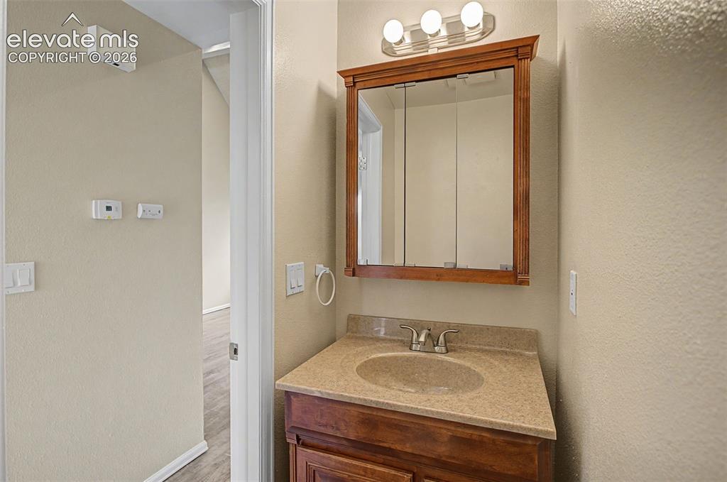 Image 16 of 26: The main level has its own half bathroom!