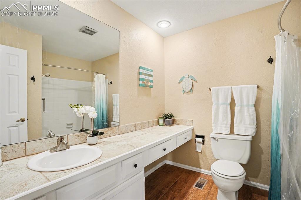 Image 15 of 29: Open and well-designed main level full bathroom featuring a functional layo