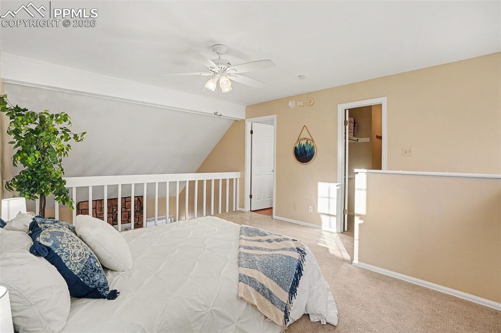 Image 17 of 29: Spacious and bright primary bedroom located on the upper level, featuring a