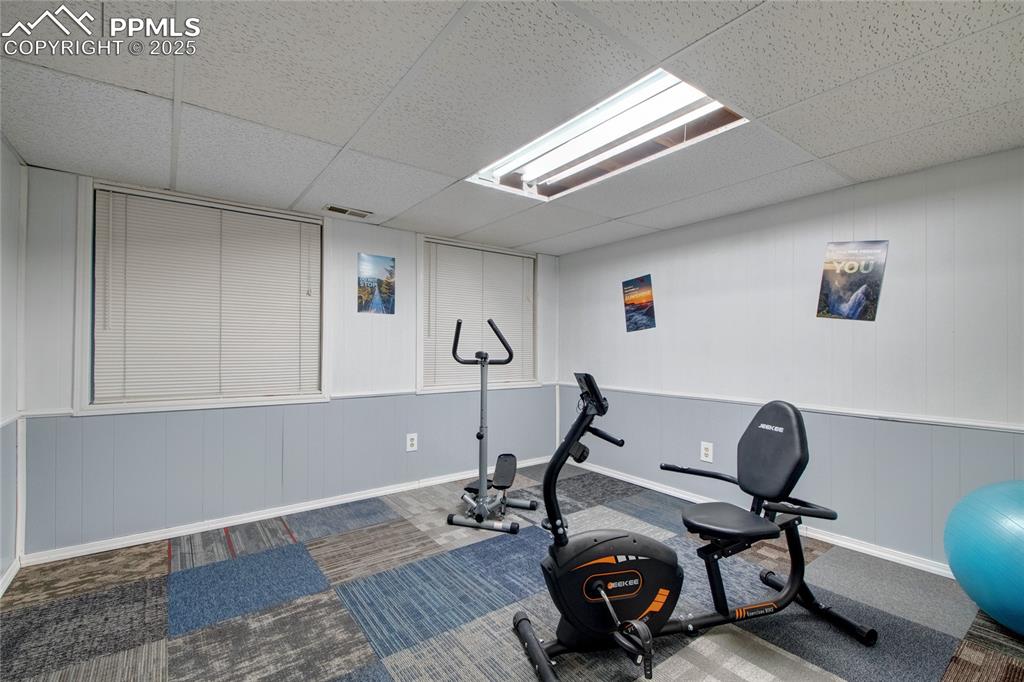 Image 36 of 38: Basement bedroom/fitness room