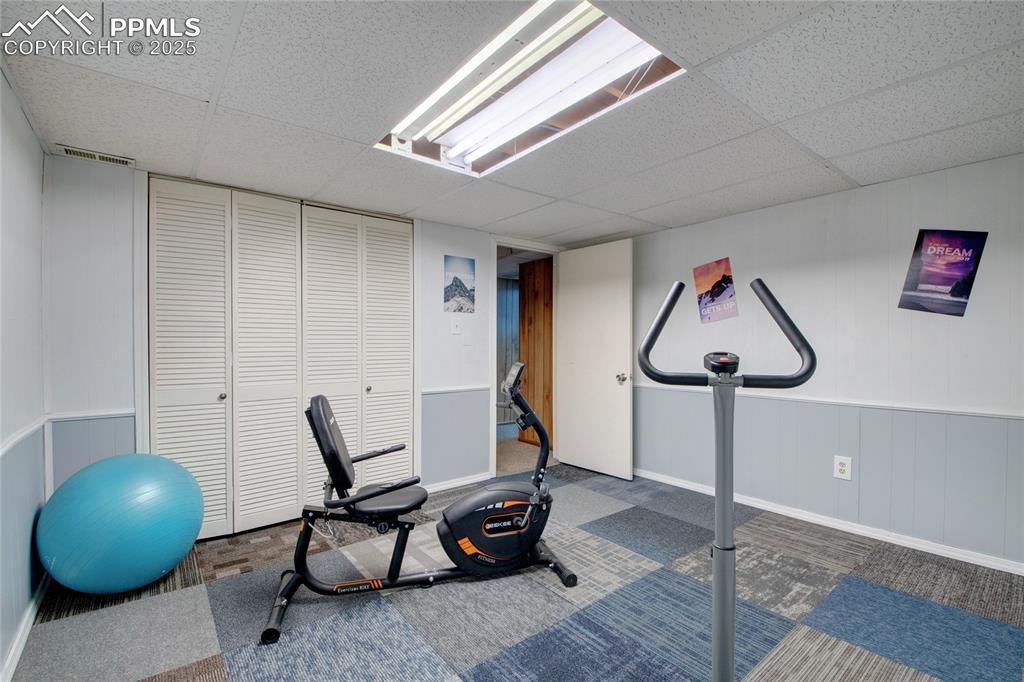 Image 37 of 38: Basement bedroom/fitness room