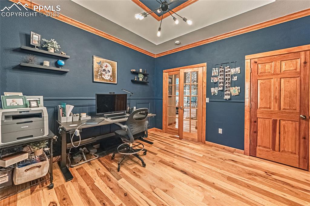Image 21 of 50: Office featuring crown molding, light wood-type flooring, and french doors