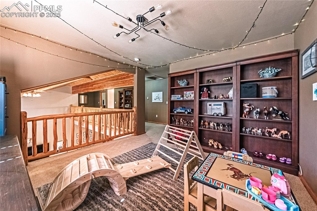 Image 32 of 50: Upper level loft, perfect play area for kids or second office.