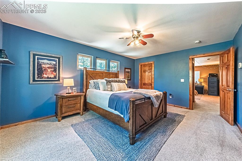 Image 34 of 50: Carpeted bedroom featuring a closet and a ceiling fan