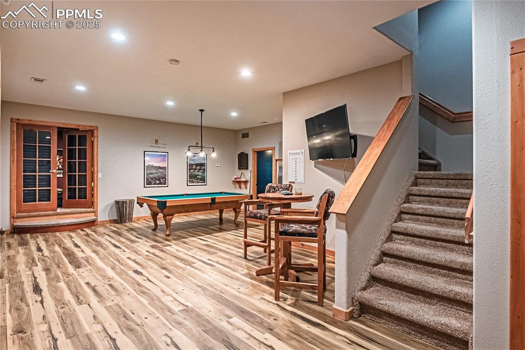 Image 37 of 50: Rec room with pool table, recessed lighting, and light wood-style floors