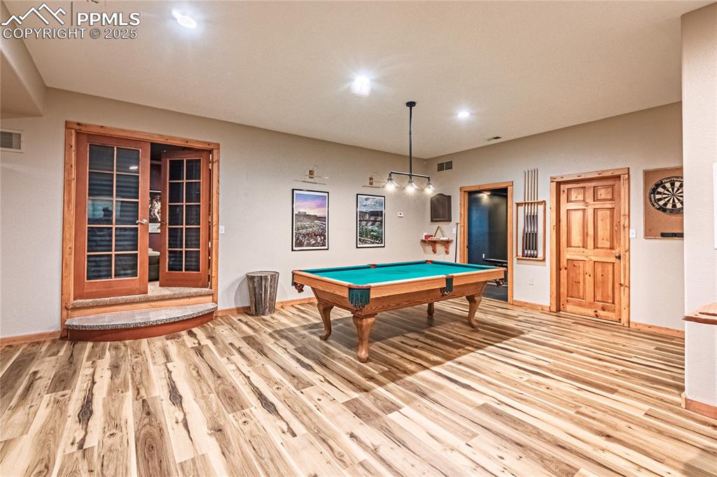 Image 39 of 50: Game room with billiards table and light wood-type flooring