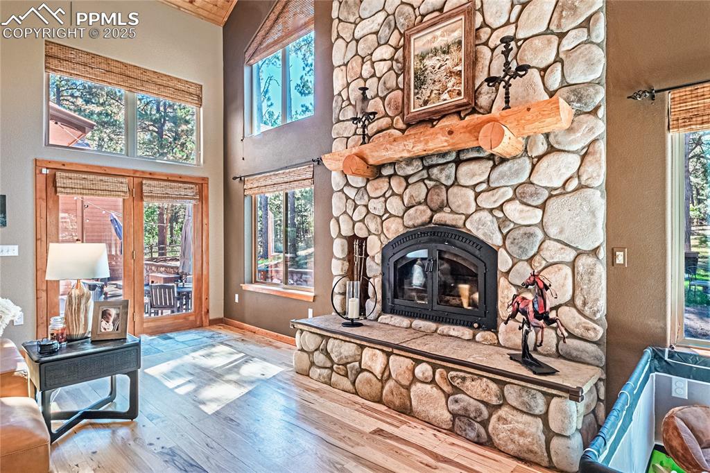 Image 5 of 50: Living room featuring hardwood / wood-style floors, plenty of natural light
