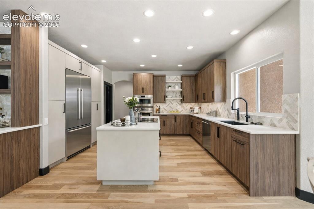 Image 13 of 46: Custom cabinetry with Fisher and Paykel appliances
