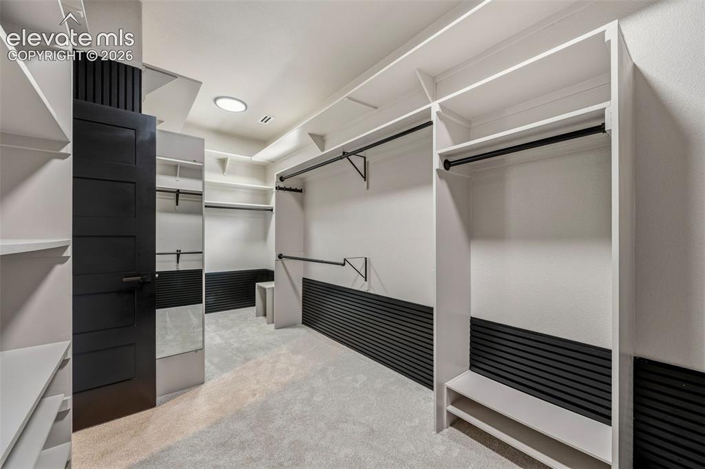 Image 20 of 46: Expansive walk-in closet