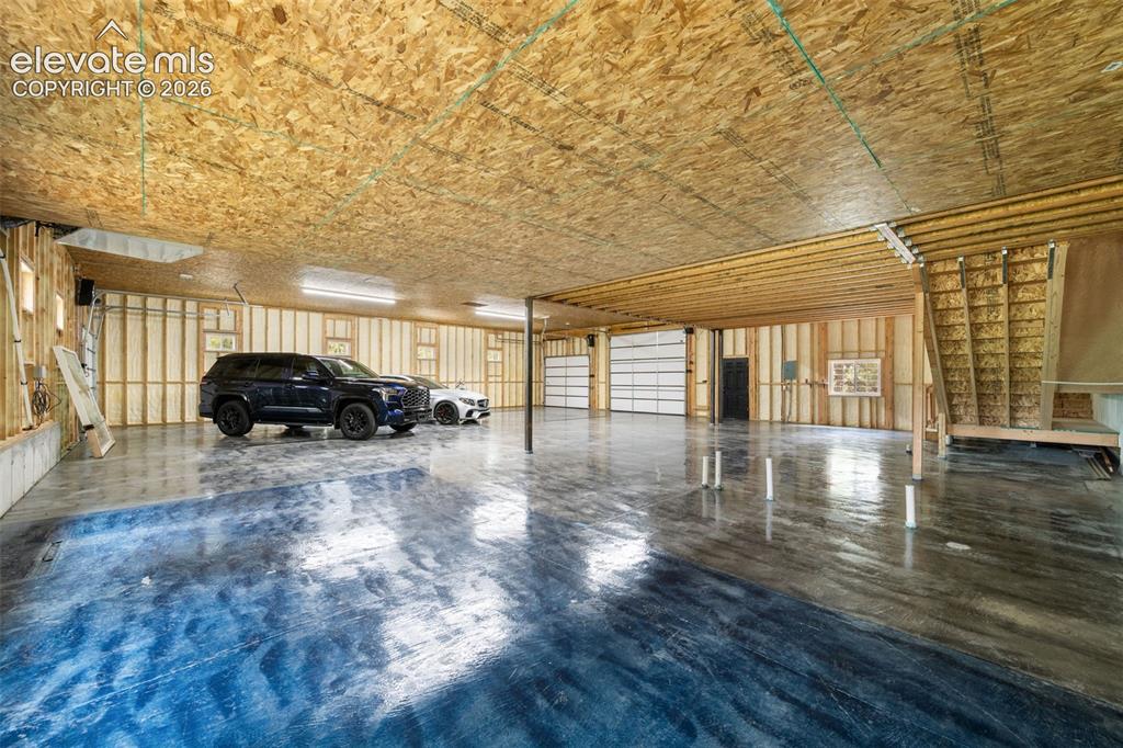 Image 39 of 46: 10ft overhead doors. 50ft of depth. Heated and spray foam insulated.