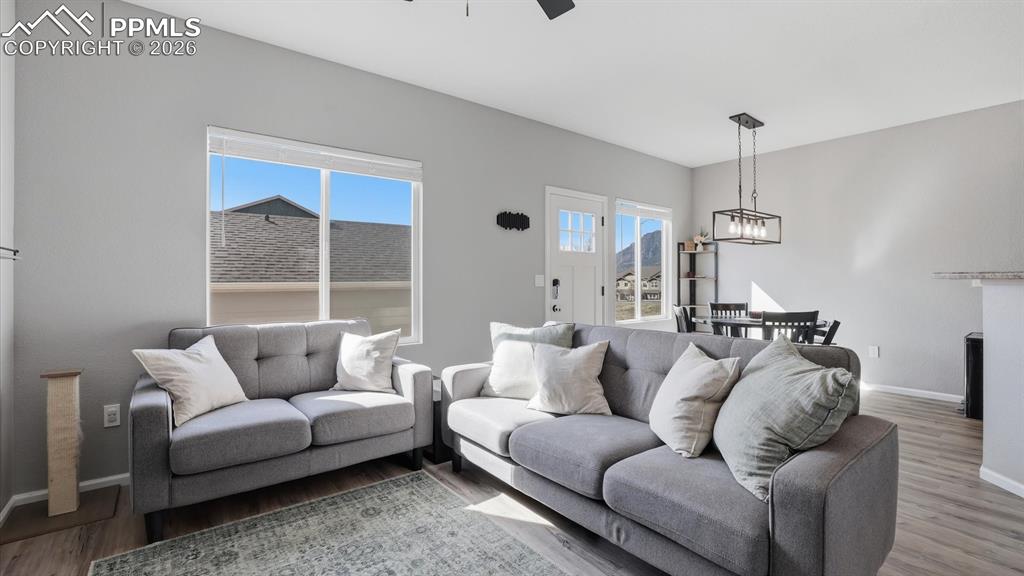 Image 10 of 50: The Family room has backyard views and flows into the Dining Area and Kitch