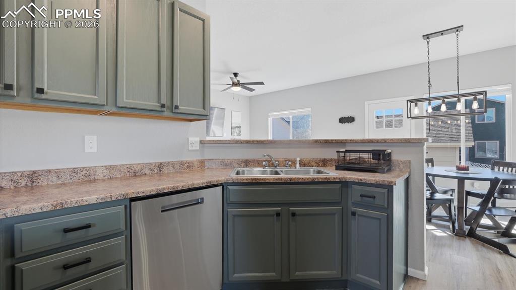 Image 19 of 50: The Kitchen has a double stainless steel sink and overlooks the Dining Area