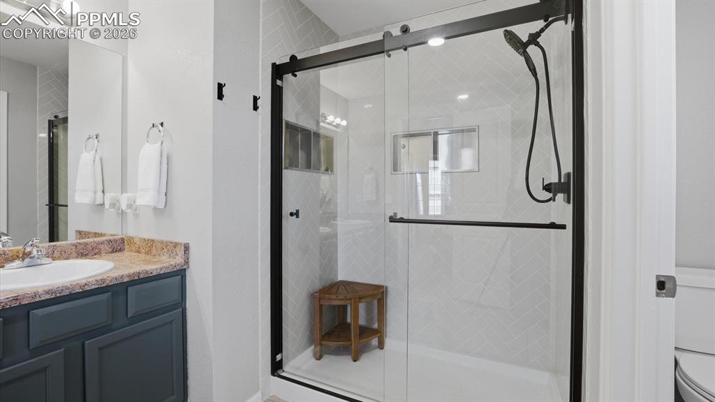 Image 27 of 50: Enclosed tiled shower in the Primary Bathroom.