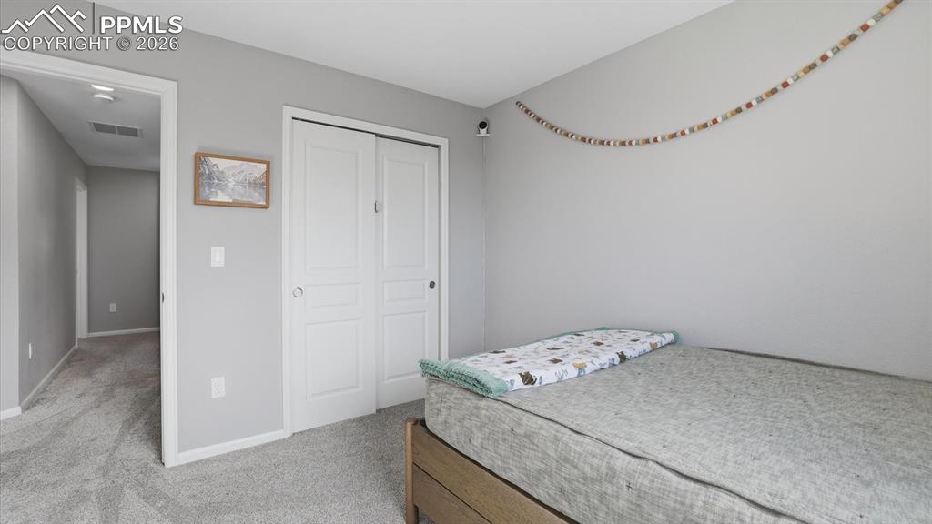 Image 30 of 50: View of the Primary Bedroom from the Primary Bathroom.