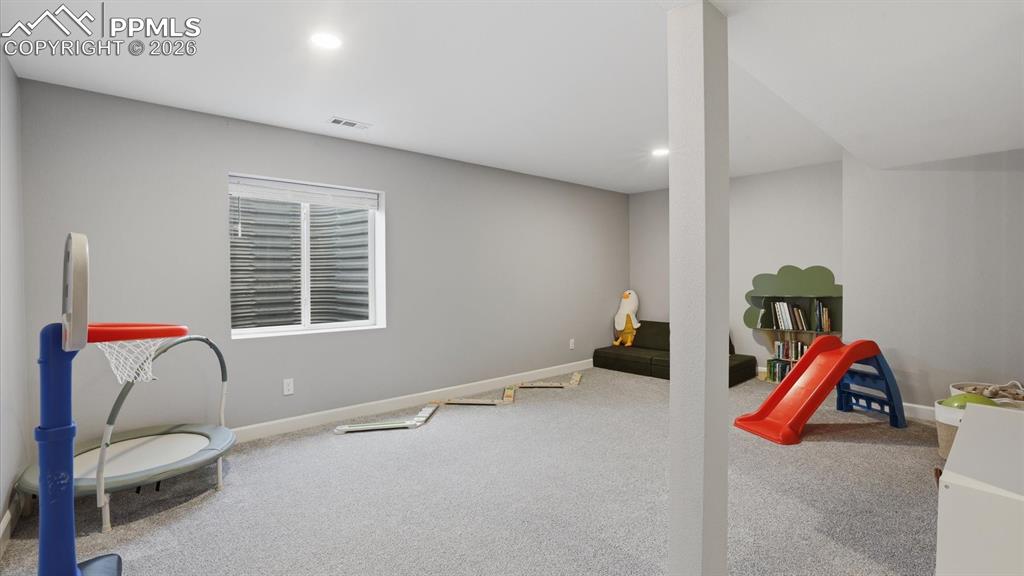 Image 34 of 50: Basement Family/Rec Room provides flexibility and expanded living space to